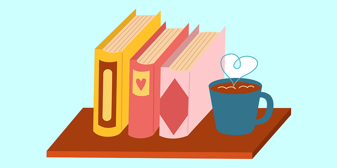 Ett litet bord med en kaffekopp och tre böcker.